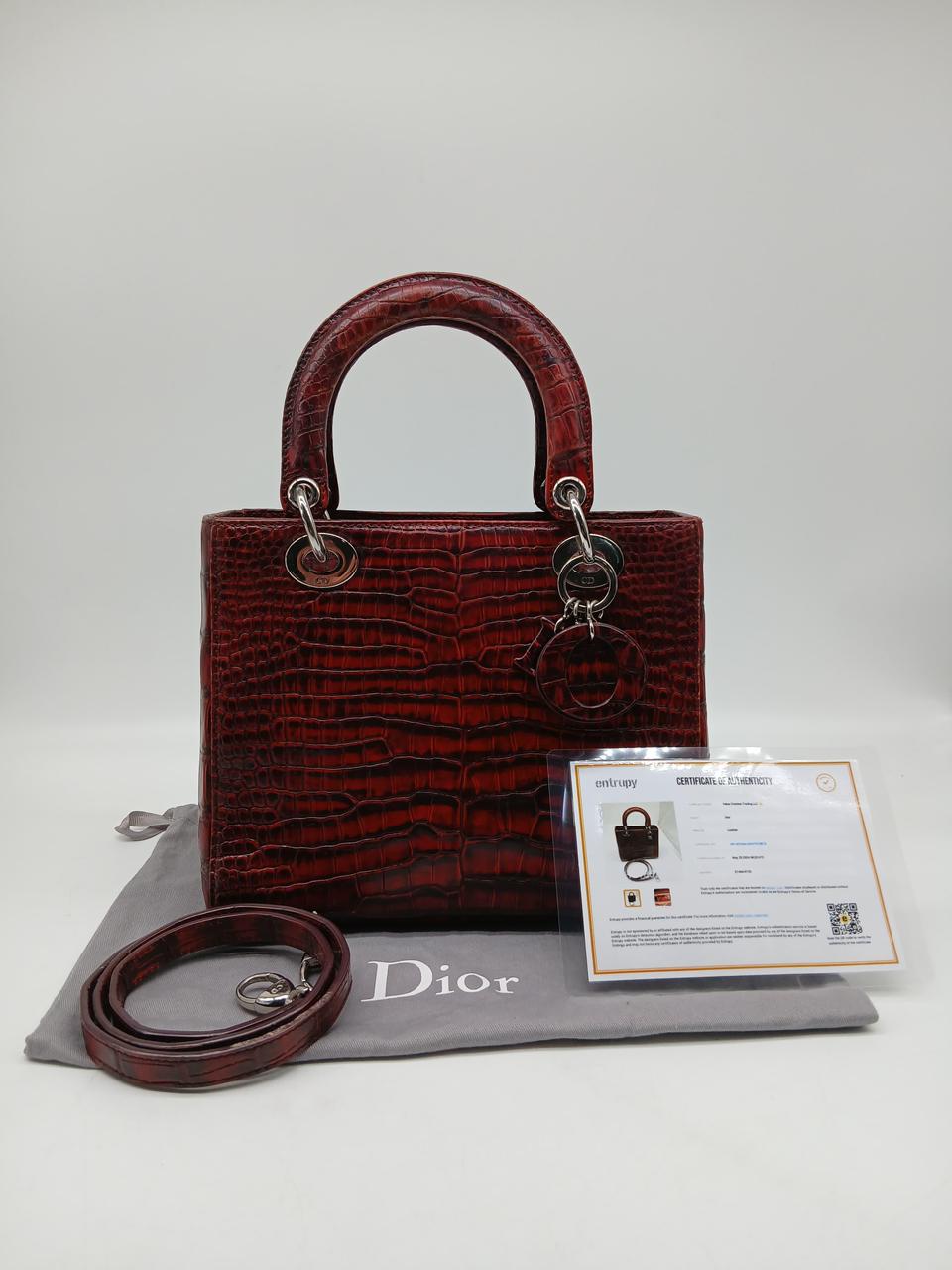 Christian Dior Lady Dior Red/ Dark Red Crocodile leather Medium Satchel Bag
In Very Good Condition
Inclusions: Dustbag, Strap, Entrupy Certificate